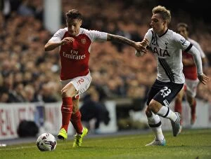 Tottenham Hotspur v Arsenal Capital One Cup 2015/16 Collection: Intense Rivalry: Debuchy vs. Eriksen in the Capital One Cup Showdown between Arsenal and Tottenham