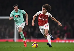 Arsenal V Bournemouth 2018-19 Prints: Intense Rivalry: Guendouzi vs. Gosling Clash at Arsenal's Emirates Stadium