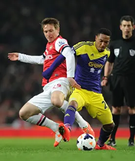 Arsenal V Swansea City 2013-14 Prints: Intense Rivalry: Kallstrom vs. De Guzman - Arsenal vs. Swansea Football Battle