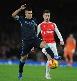 Arsenal V Manchester City 2015-16 Prints: Intense Rivalry: Koscielny vs. Agüero - Arsenal vs. Manchester City (December 2015)