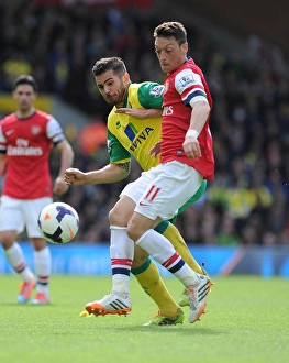 Norwich City V Arsenal 2013-14 Prints: Intense Rivalry: Mesut Ozil vs. Robert Snodgrass Clash at Carrow Road, 2014