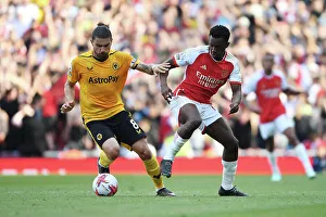 Arsenal V Wolverhampton Wanderers 2022-23 Prints: Intense Rivalry: Neves vs. Nketiah - Arsenal vs. Wolverhampton Wanderers (2022-23)