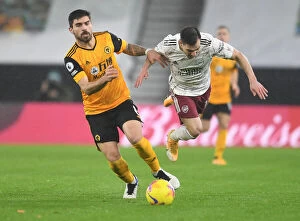 Wolverhampton Wanderers v Arsenal 2020-21 Collection: Intense Rivalry: Neves vs. Soares Battle in Wolverhampton Wanderers vs. Arsenal Premier League Clash