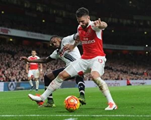 Arsenal v Tottenham Hotspur 2015-16 Collection: Intense Rivalry: Olivier Giroud vs. Danny Rose Battle at Arsenal vs. Tottenham (2015-16)