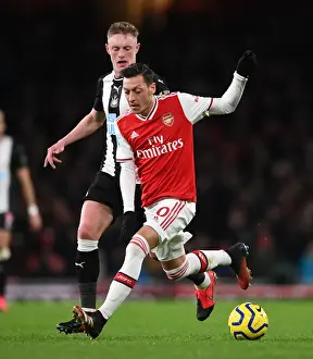 Intense Rivalry: Ozil vs. Longstaff Clash in Arsenal vs. Newcastle Premier League Showdown