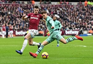 West Ham United v Arsenal 2018-19 Collection: Intense Rivalry: Ramsey vs. Rice in the London Derby - West Ham United vs. Arsenal FC