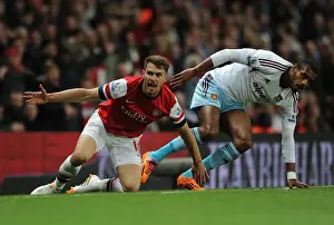 Arsenal V West Ham United 2013/14 Prints: Intense Rivalry: Ramsey vs. Vaz Te Clash in Arsenal's Battle against West Ham