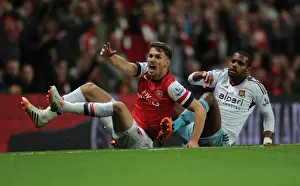 Arsenal V West Ham United 2013/14 Prints: Intense Rivalry: Ramsey vs. Vaz Te Showdown in Arsenal vs. West Ham Premier League Clash