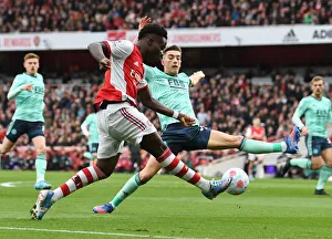 Intense Rivalry: Saka vs. Thomas - Arsenal's Young Star Clashes with Leicester Defender in Premier League Showdown