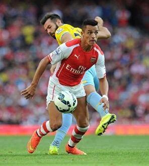 Images Dated 16th August 2014: Intense Rivalry: Sanchez vs. Ledley - Arsenal vs. Crystal Palace Face-Off
