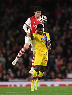 Arsenal V Crystal Palace 2021-22 Prints: Intense Rivalry: Tomiyasu vs. Edouard Battle in Arsenal vs