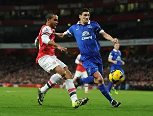 Arsenal V Everton 2013-14 Prints: Intense Rivalry: Walcott vs. Barry in Arsenal v Everton Premier League Clash