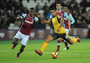 West Ham United V Arsenal 2016-17 Prints: Intense Rivalry: Walcott vs. Fernandes - Arsenal vs. West Ham United (2016-17)
