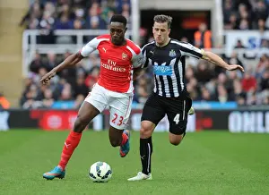 Intense Rivalry: Welbeck vs. Taylor Clash in Newcastle United vs. Arsenal Premier League Match