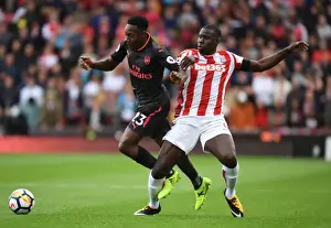 Stoke City V Arsenal 2017-18 Prints: Intense Rivalry: Welbeck vs Zouma Clash in Stoke City vs Arsenal (2017-18)