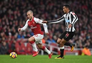 Images Dated 16th December 2017: Intense Rivalry: Wilshere vs. Hayden Clash in Arsenal vs. Newcastle Football Match