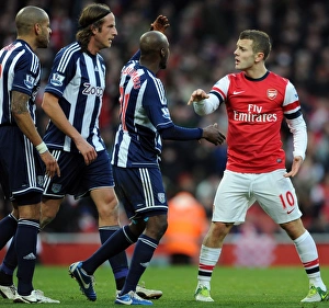 Intense Rivalry: Wilshere vs. Reid, Olsson, and Mulumbu Clash in Arsenal vs. West Bromwich Albion Showdown