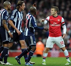Images Dated 8th December 2012: Intense Rivalry: Wilshere vs. Reid, Olsson, and Mulumbu Clash in Arsenal vs