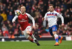 Intense Rivalry: Wilshere vs. Shaqiri - Arsenal's Battle Against Stoke