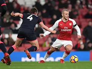 Arsenal V Huddersfield Town 2017-18 Prints: Intense Rivalry: Wilshere vs. Whitehead Clash in Arsenal vs. Huddersfield Football Match