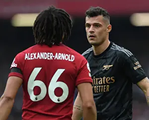 Intense Rivalry: Xhaka vs. Alexander-Arnold - A Battle of Wits at Anfield, Premier League 2022-23: Granit Xhaka and Trent Alexander-Arnold Lock Horns in Epic Showdown