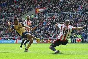 Sunderland V Arsenal 2015-16 Prints: Intense Showdown: Iwobi vs. Kaboul in Arsenal's Battle against Sunderland