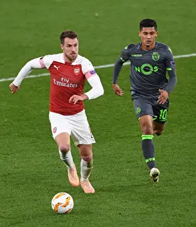 Arsenal V Sporting Clube De Portugal 2018-19 Prints: Intense Showdown: Ramsey vs. Montero in Arsenal's Europa League Battle