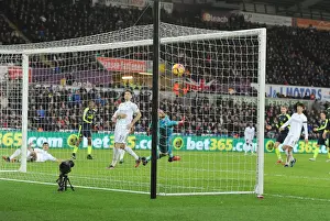 Swansea City V Arsenal - 2016-17 Prints: Iwobi Scores Deflected Goal Against Former Team-Mate Fabianski for Arsenal at Swansea