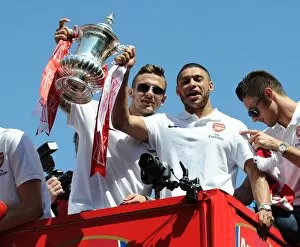 Arsenal Trophy Parade 2014 Collection: Jack Wilshere and Alex Oxlade-Chamberlain on the Arsenal Trophy Parade. Islington, 18 / 5 / 14