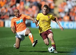 Images Dated 10th April 2011: Jack Wilshere (Arsenal) Alex Baptiste (Blackpool). Blackpool 1: 3 Arsenal