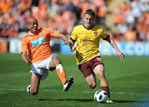 Images Dated 10th April 2011: Jack Wilshere (Arsenal) Alex Baptiste (Blackpool). Blackpool 1: 3 Arsenal