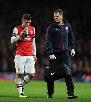 Images Dated 8th December 2013: Jack Wilshere (Arsenal) and Arsenal Physio Colin Lewin. Arsenal 1: 1 Everton. Barclays