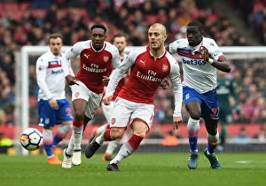 Images Dated 1st April 2018: Jack Wilshere (Arsenal) Badou Ndiaye (Stoke). Arsenal 3: 0 Stoke City. Premier League