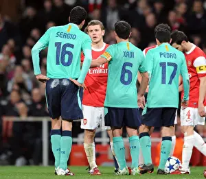 Jack Wilshere (Arsenal) chats to Sergio Busquets and Xavi (Barcelona). Arsenal 2