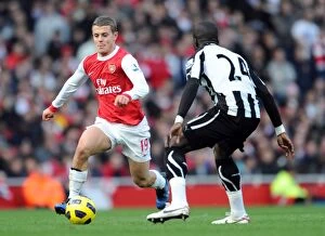 Arsenal v Newcastle United 2010-11 Collection: Jack Wilshere (Arsenal) Cheil Tiote (Newcastle). Arsenal 0: 1 Newcastle United