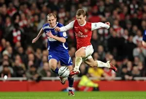 Images Dated 25th January 2011: Jack Wilshere (Arsenal) Colin Healey (Ipswich). Arsenal 3: 0 Ipswich Town