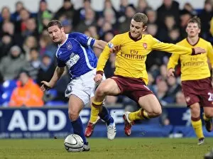 Images Dated 12th January 2011: Jack Wilshere (Arsenal) David Norris (Ipswich). Ipswich Town 1: 0 Arsenal