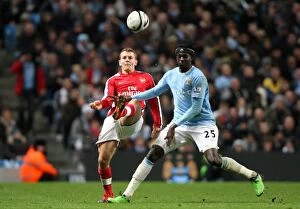 Manchester City v Arsenal - Carling Cup 2009-10 Collection: Jack Wilshere (Arsenal) Emmanuel Adebayor (Man City). Manchester City 3: 0 Arsenal