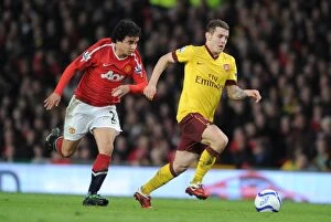 Images Dated 12th March 2011: Jack Wilshere (Arsenal) Fabio da Silva (Man United). Manchester United 2: 0 Arsenal