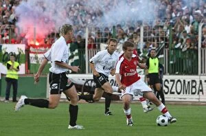 Images Dated 24th July 2008: Jack Wilshere of Arsenal Faces Off Against Andras Kaj of Szombathely in 2008