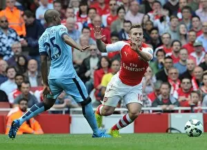 Images Dated 13th September 2014: Jack Wilshere (Arsenal) Fernadinho (Man City). Arsenal 2: 2 Manchester City. Barclays Premier League