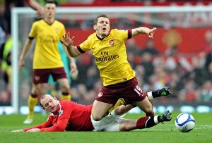 Images Dated 12th March 2011: Jack Wilshere (Arsenal) is fouled by Wayne Rooney (Man Utd). Manchester United 2