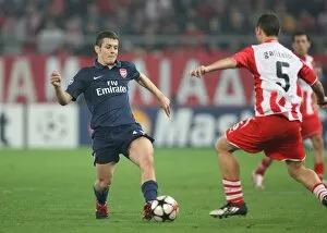 Images Dated 9th December 2009: Jack Wilshere (Arsenal) Giorgos Galitsios (Olympiacos). Olympiacos 1: 0 Arsenal