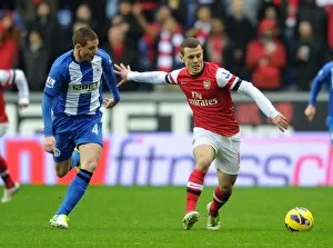 Wigan Athletic v Arsenal 2012-13 Collection: Jack Wilshere (Arsenal) James McCarthy (Wigan). Wigan Athletic 0: 1 Arsenal. Barclays Premier League