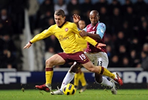 West Ham United v Arsenal 2010-11 Collection: Jack Wilshere (Arsenal) Luis Boa Morte (West Ham). West Ham United 0: 3 Arsenal