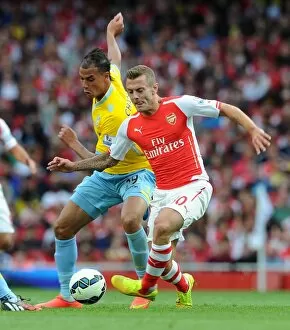 Images Dated 16th August 2014: Jack Wilshere (Arsenal) Maroaune Chamakh (Palace). Arsenal 2: 1 Crystal Palace. Barclays