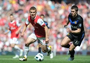 Arsenal v Manchester United 2010-2011 Collection: Jack Wilshere (Arsenal) Michael Carrick (Man United). Arsenal 1: 0 Manchester United