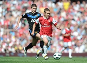 Arsenal v Manchester United 2010-2011 Collection: Jack Wilshere (Arsenal) Michael Carrick (Man United). Arsenal 1: 0 Manchester United