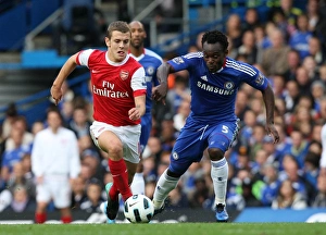 Chelsea v Arsenal 2010-11 Collection: Jack Wilshere (Arsenal) Michael Essien (Chelsea). Chelsea 2: 0 Arsenal. Barclays Premier League