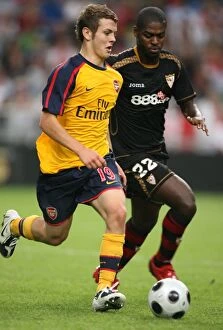 Images Dated 9th August 2008: Jack Wilshere (Arsenal) Ndri Romaric (Seville)